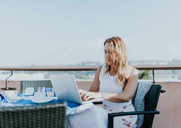 Image of lady using laptop in Credit and Cents business card blog